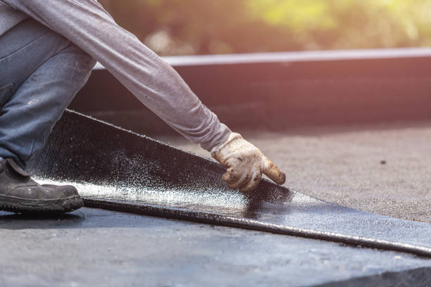Professional Waterproofing technician working in Valley, AL